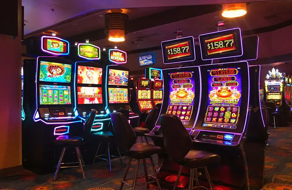 A room filled with lots of slot machines.